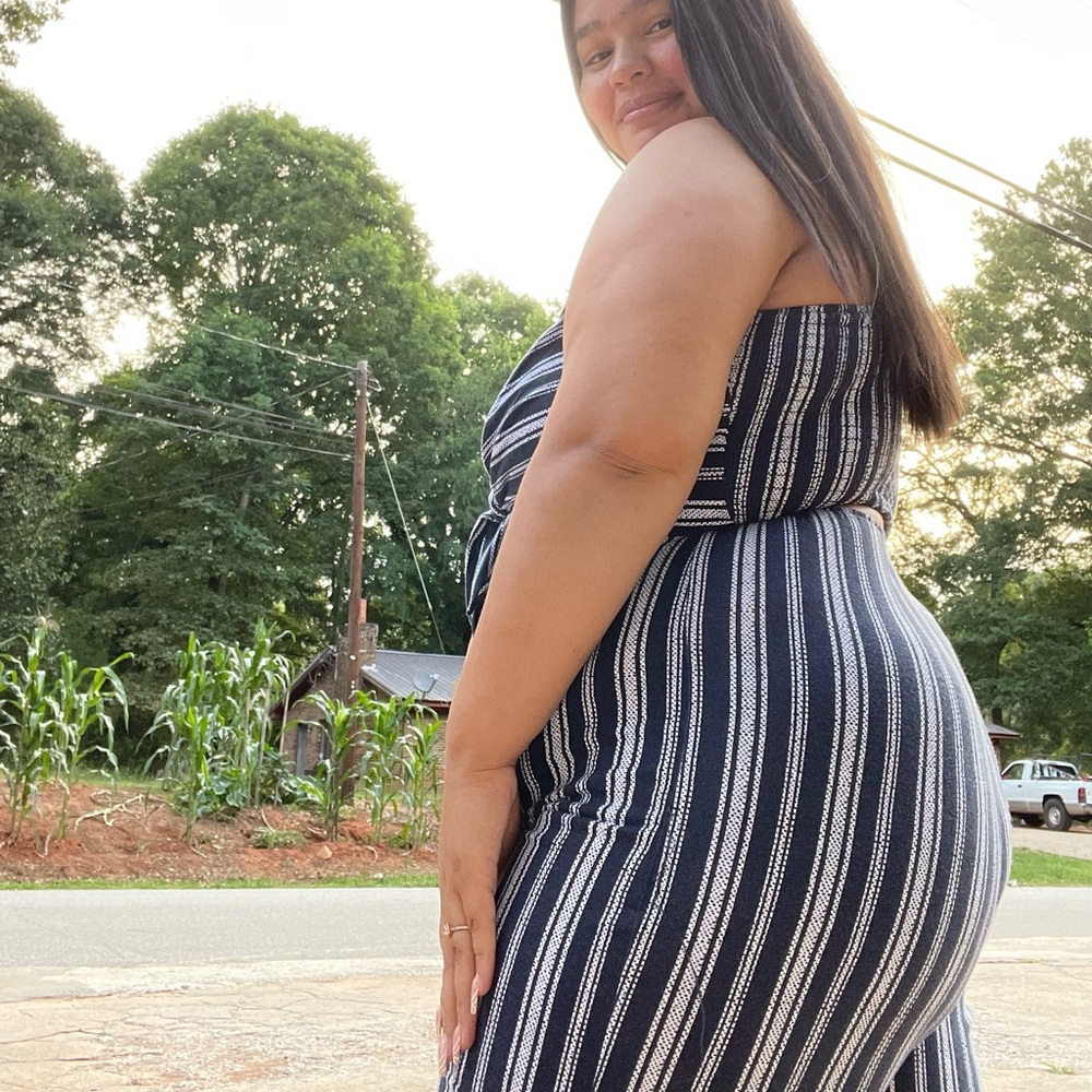 Selling this jumpsuit , shows back and long